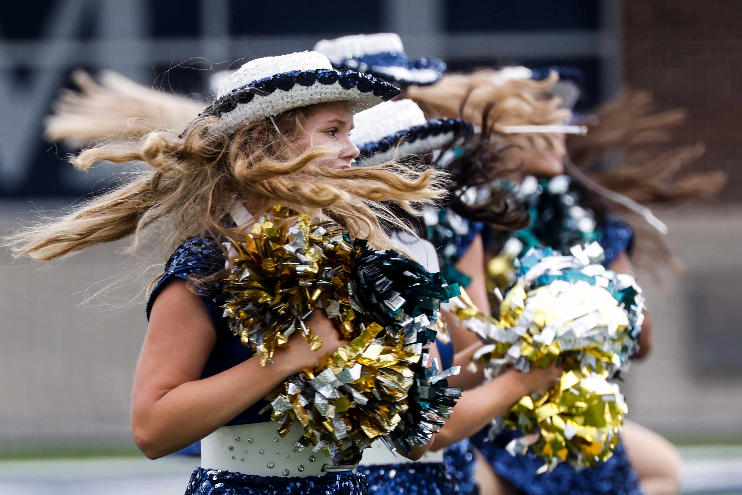 McKinney Marquettes perform after a season-opening football game against Temple High at at...