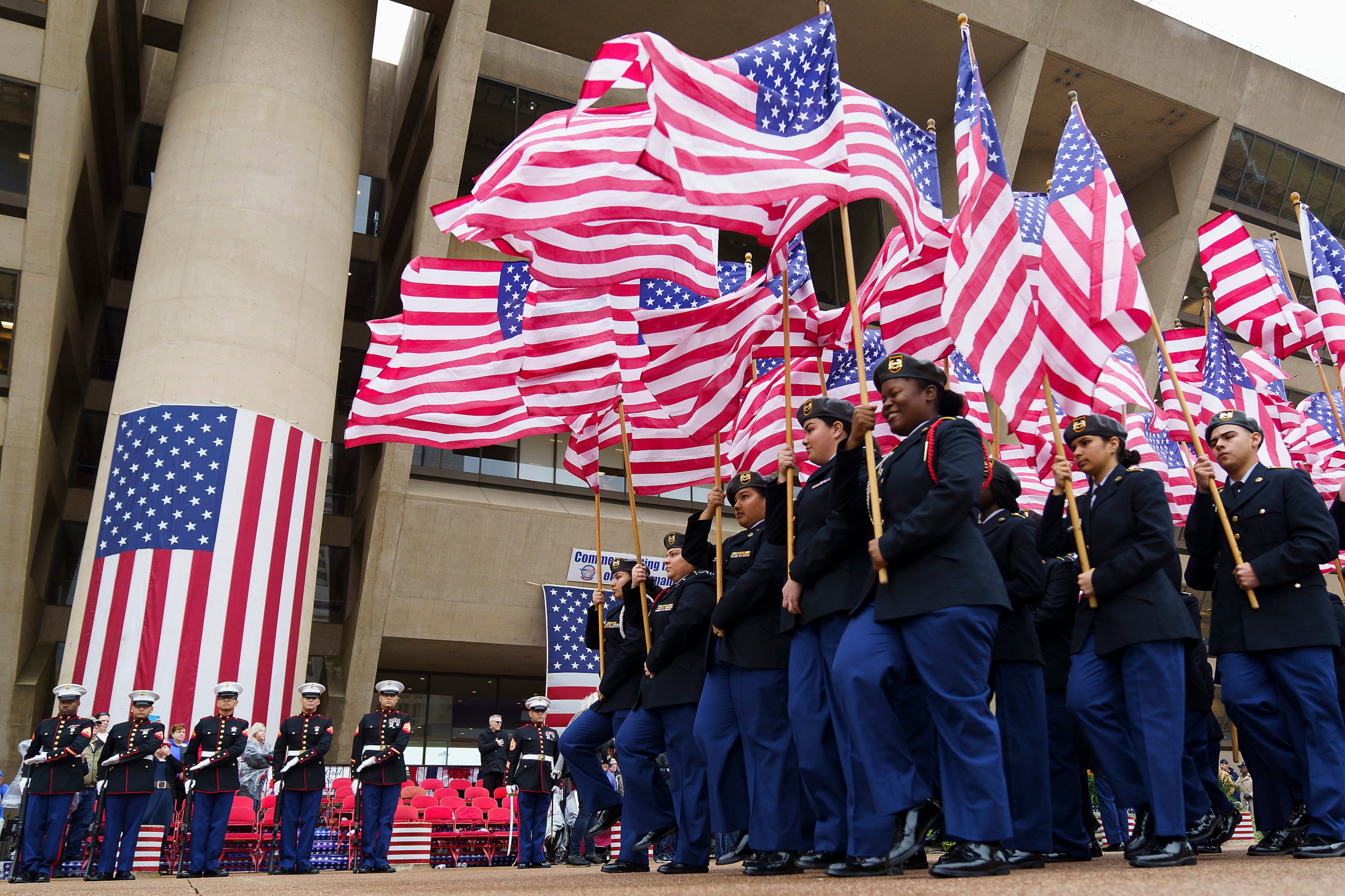 DISD JROTC cadets participate in the Massing of the Colors during an 11th hour ceremony at...