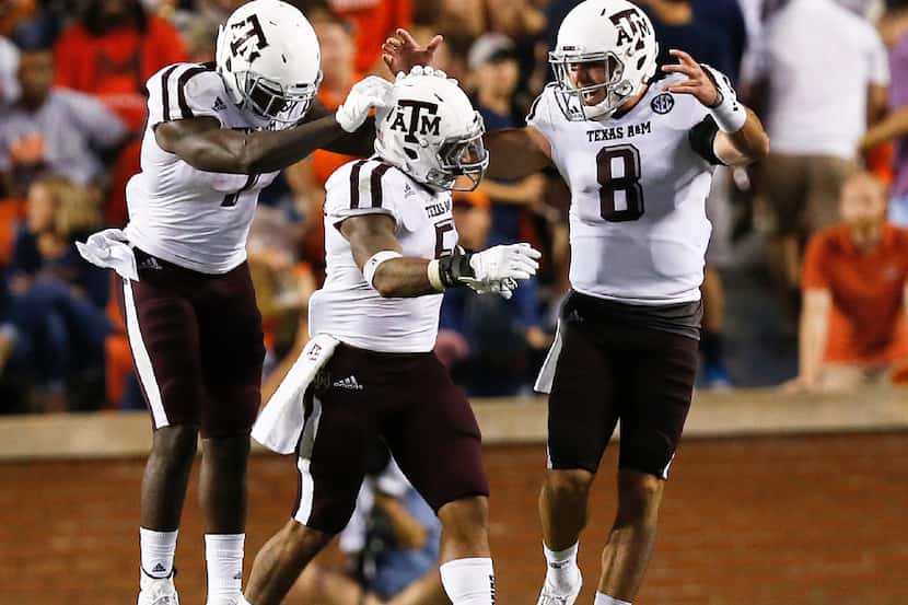 Texas A&M running back Keith Ford, left, running back Trayveon Williams, center, and...