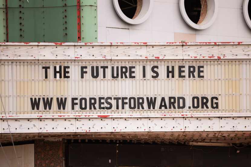 The Forest Theater's marquee displays Forest Forward's motto of “The future is here.” The...