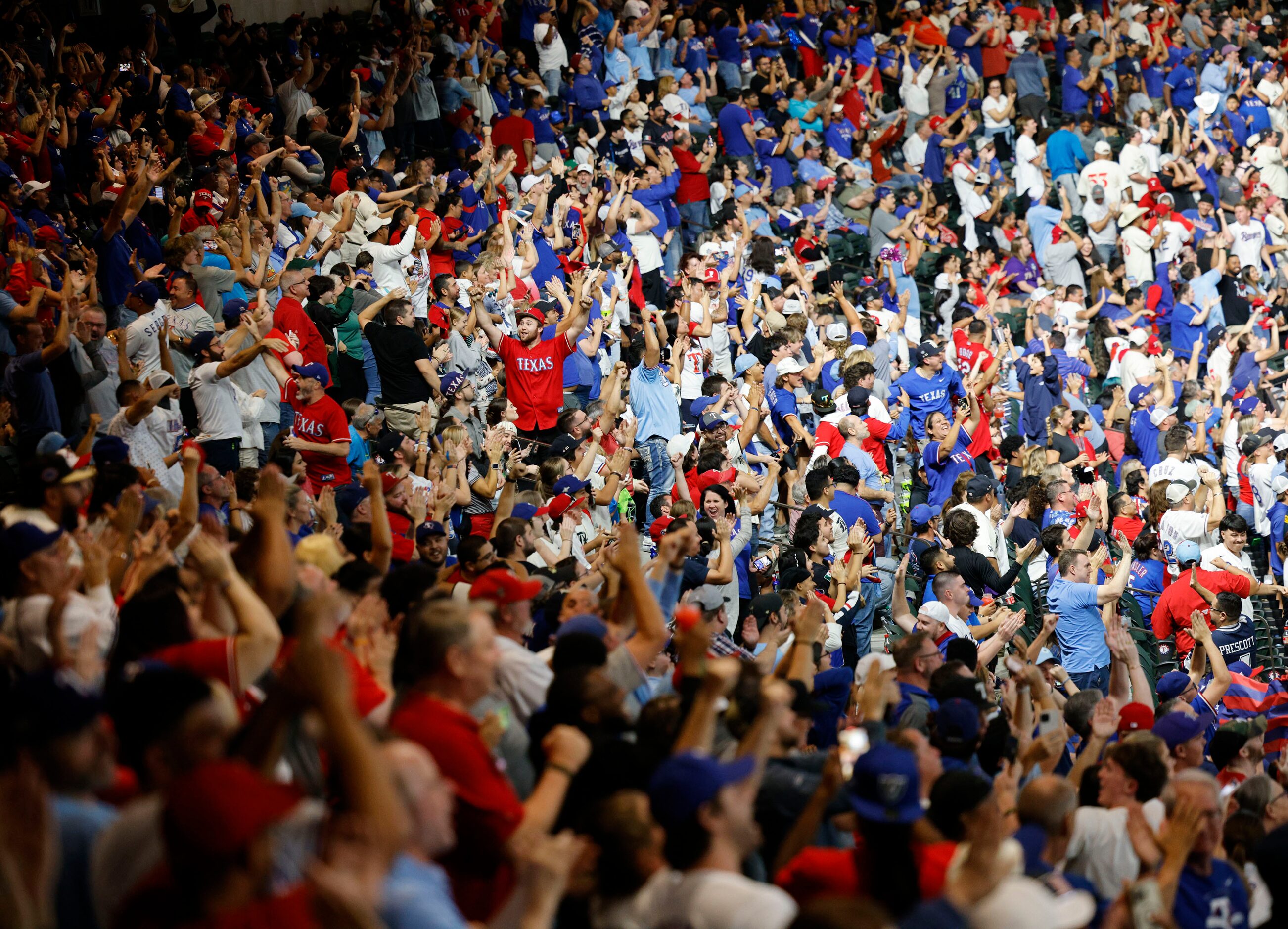 Texas Rangers fans react during a Game 7 watch party of the baseball American League...