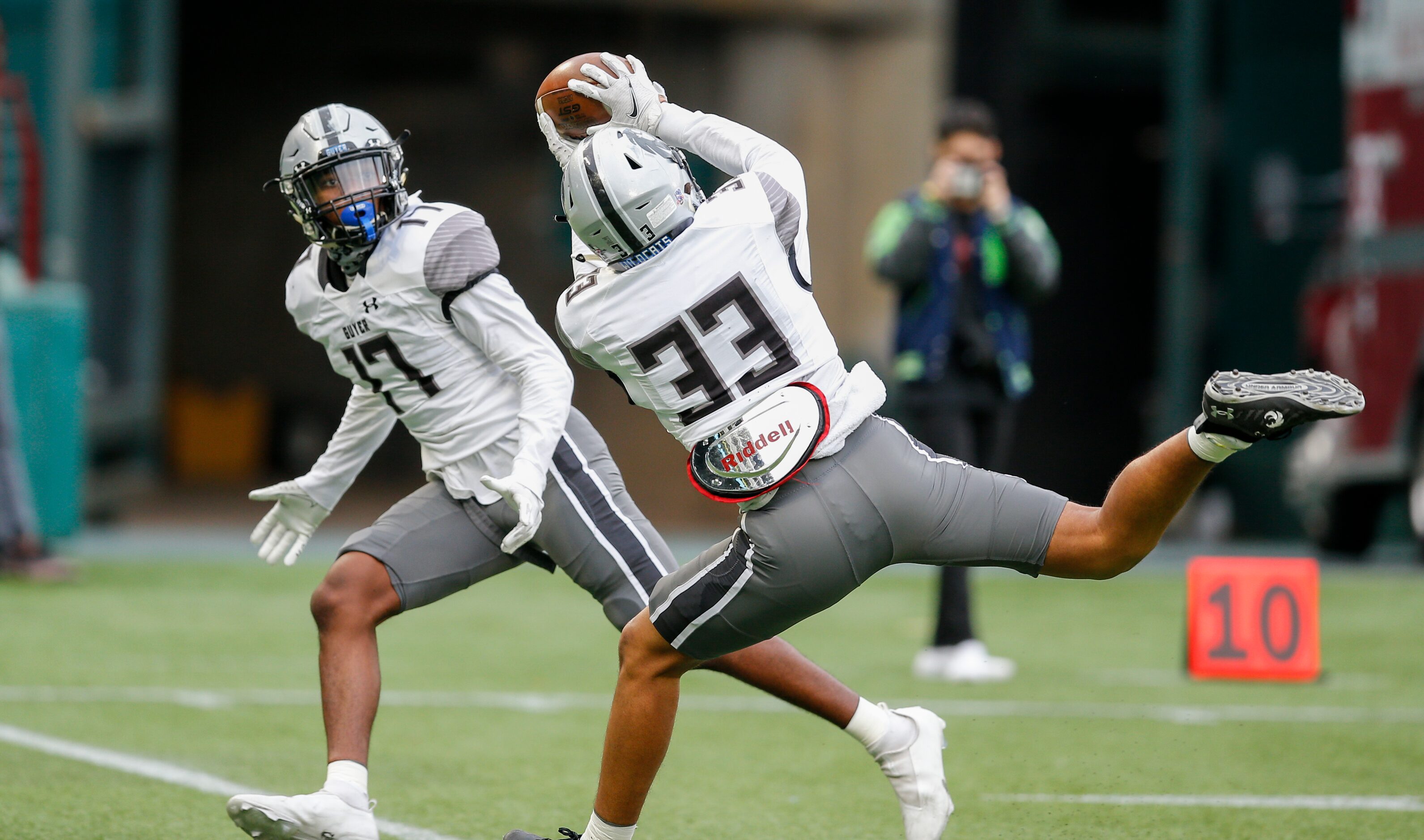 Denton Guyer senior safety Jaden Fuggett (17) looks on as junior safety Marquan Pope (33)...