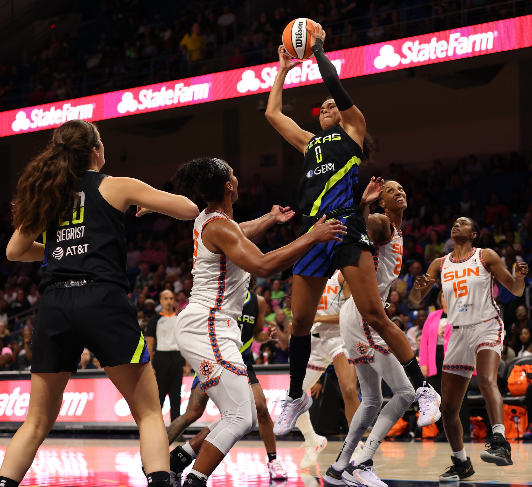 Dallas Wings forward Satou Sabally (0) skies to pull down an offensive rebound during first...