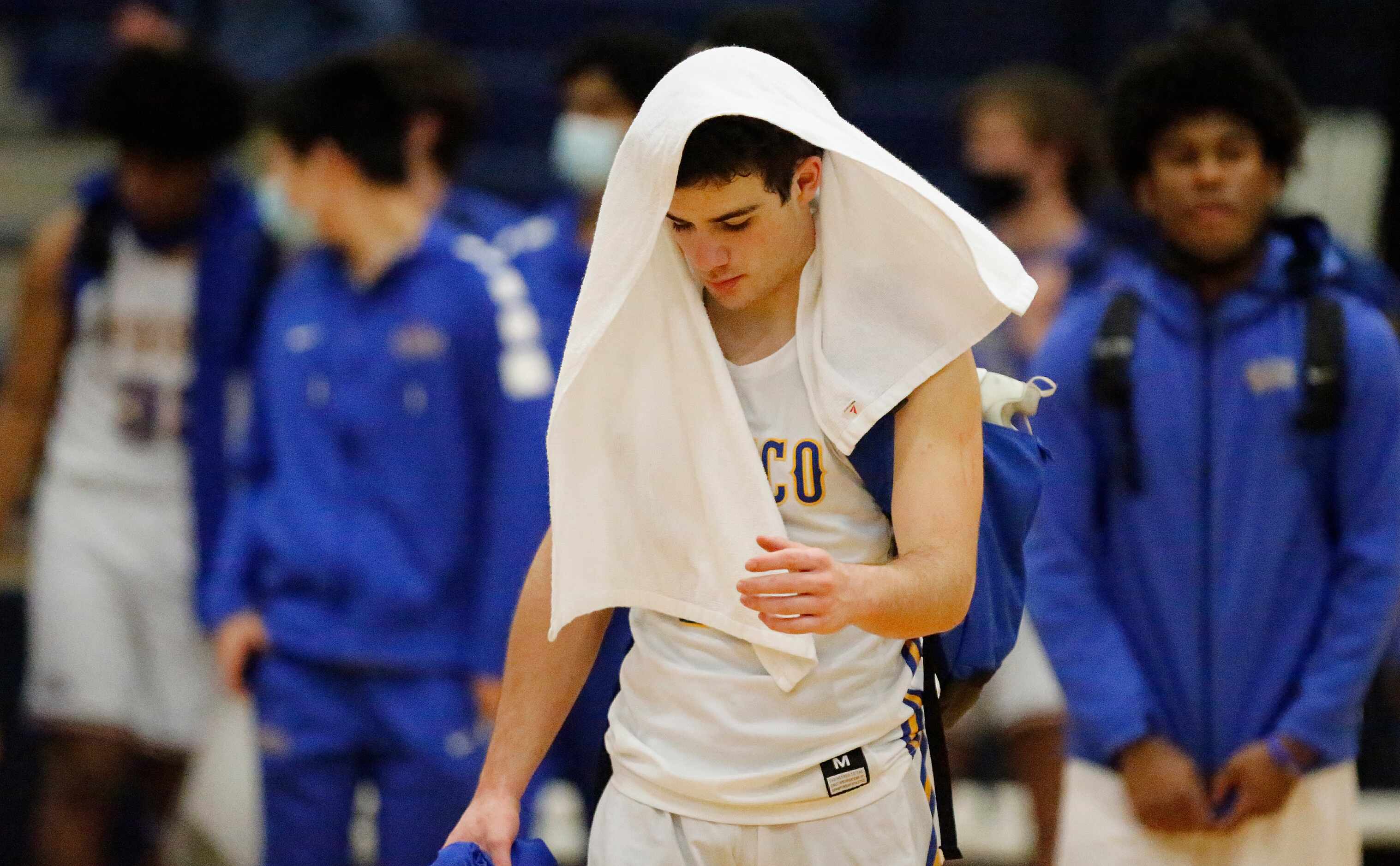 Frisco High School guard Daniel Meneses (15) walks off of the court after the loss as...