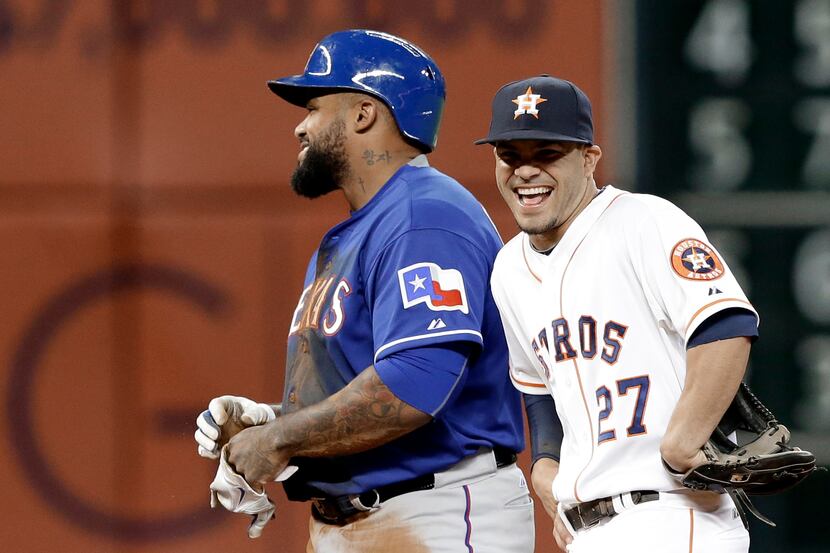 Texas Rangers' Prince Fielder, left, and Houston Astros second baseman Jose Altuve (27)...