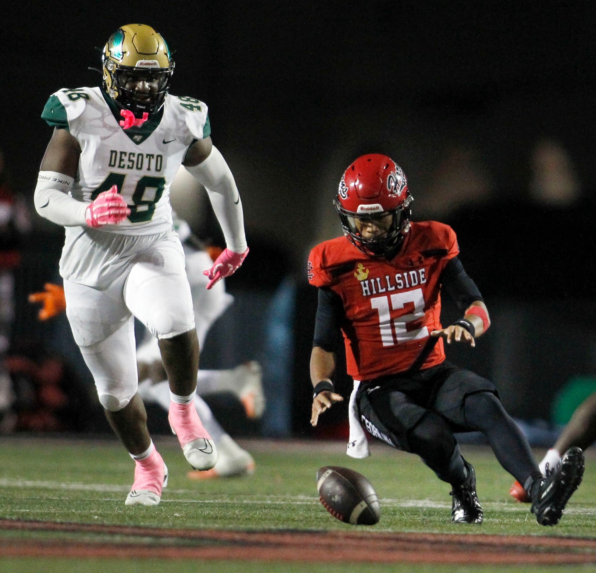 Cedar Hill quarterback Anthony Edwards (12) tracks down an errant snap as DeSoto defensive...