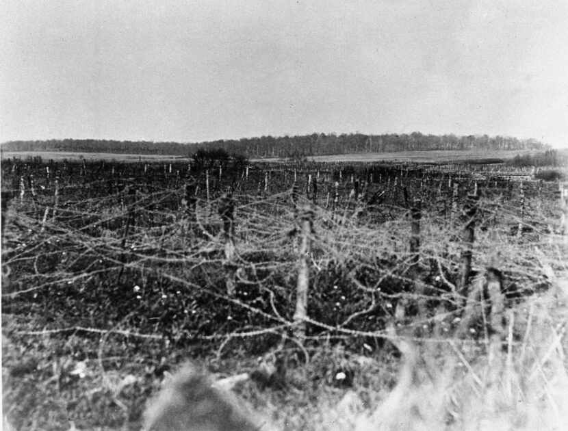 A field of barbed wire covers a no-man's land near Ancerviller, France, in April 1918. The...