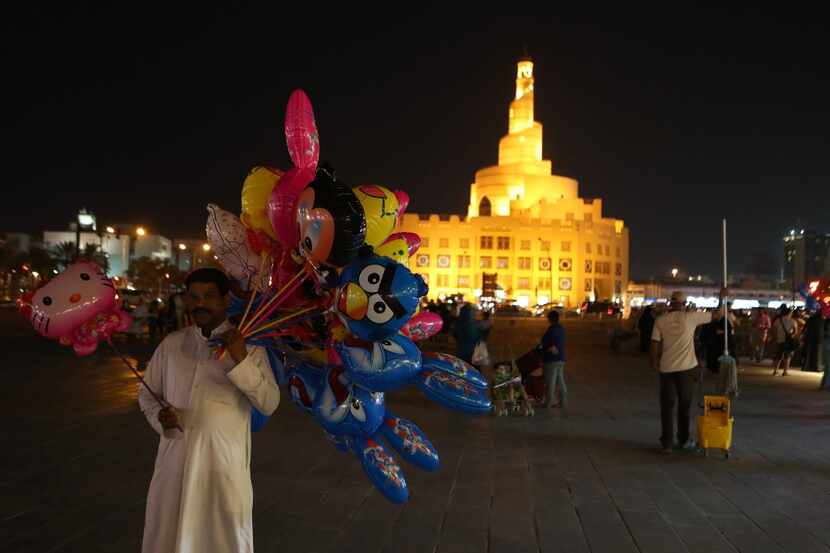 A Qatari man sell balloons at the popular Souq Waqif market, in the Qatari capital, Doha, on...
