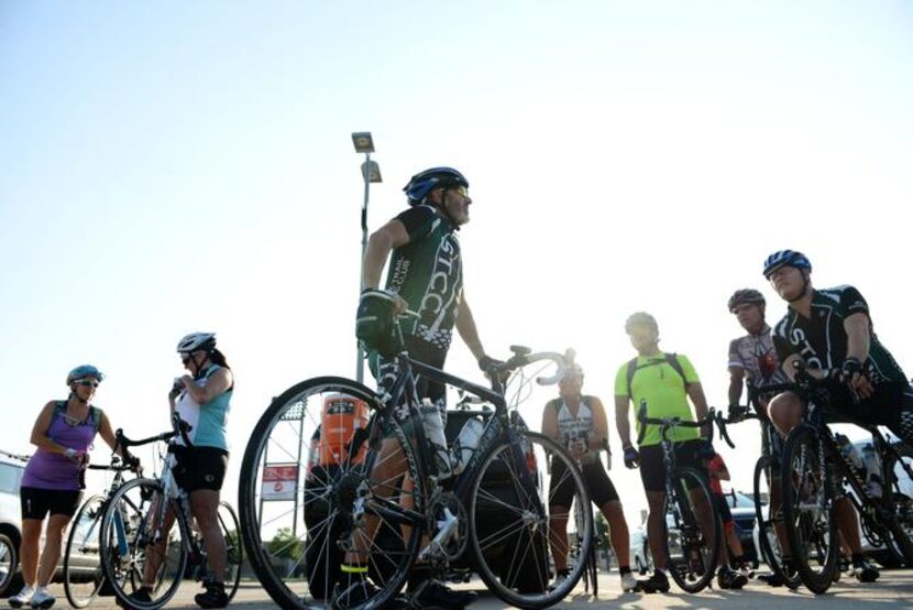 
Joel Hoback, founding member of the Shawnee Trail Cycling Club, talks to cyclists before...