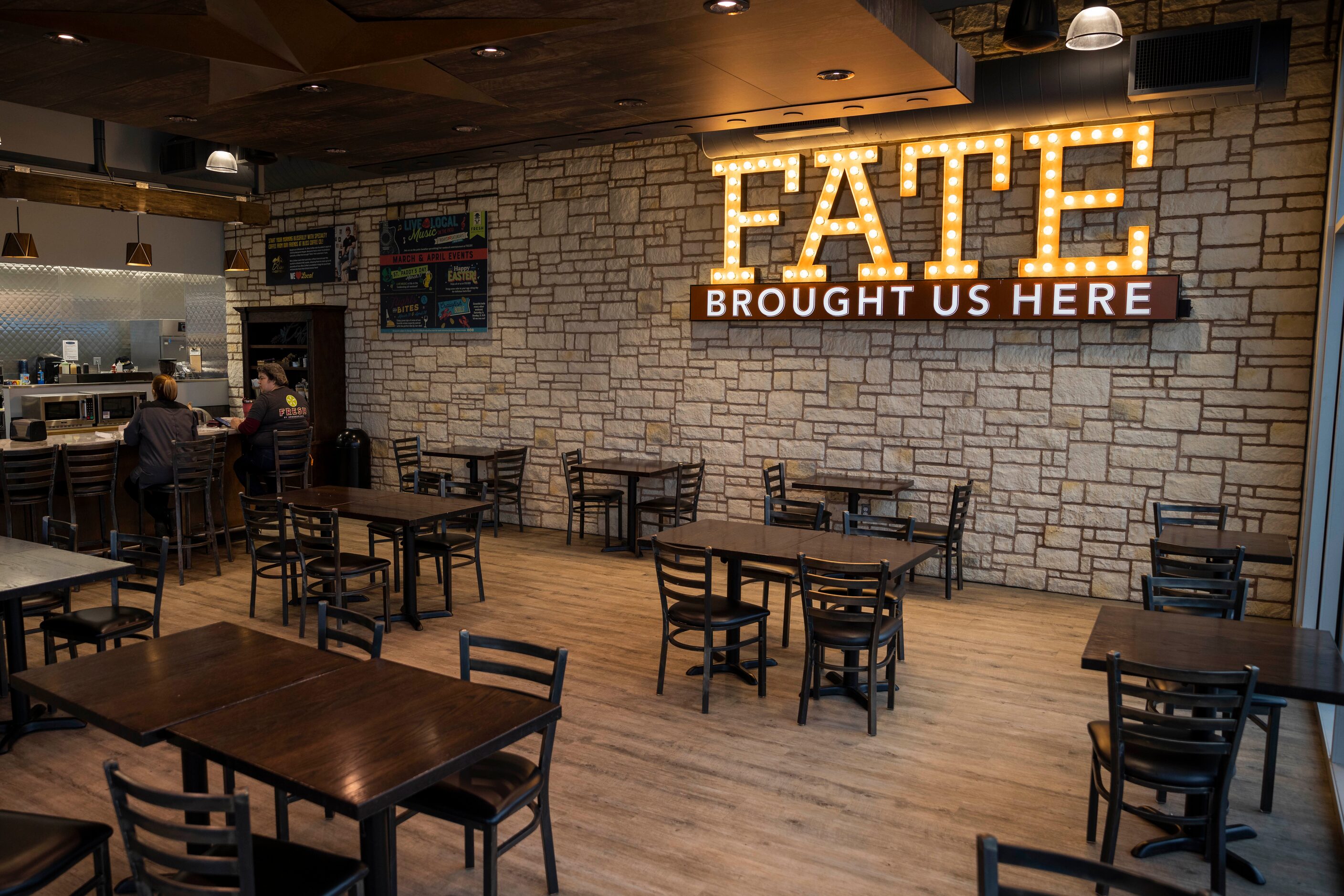 A sign that reads “Fate brought us here” hangs over the cafe area at Fresh by Brookshire's...