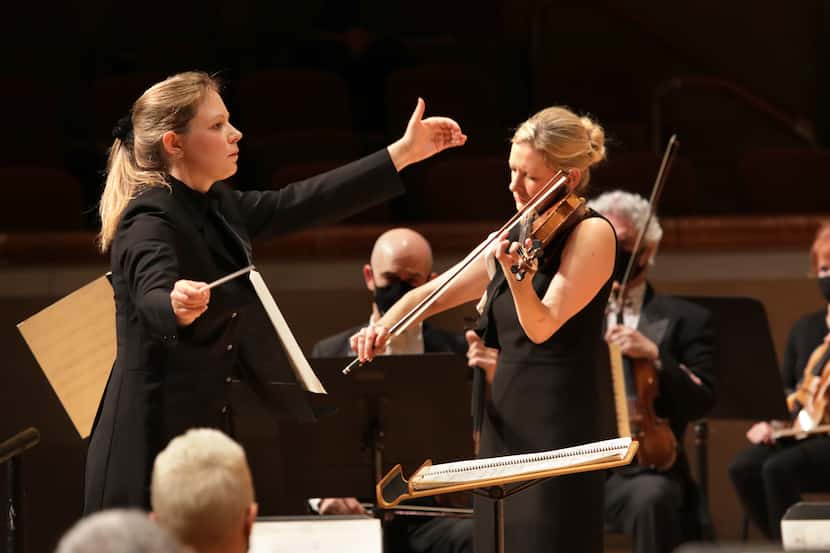 Principal guest conductor Gemma New (left) and violin soloist Angela Fuller Heyde perform...