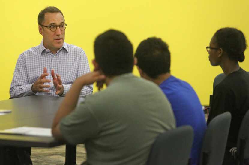 Dallas Morning News Editor Mike Wilson talks with Dallas high school students who have an...