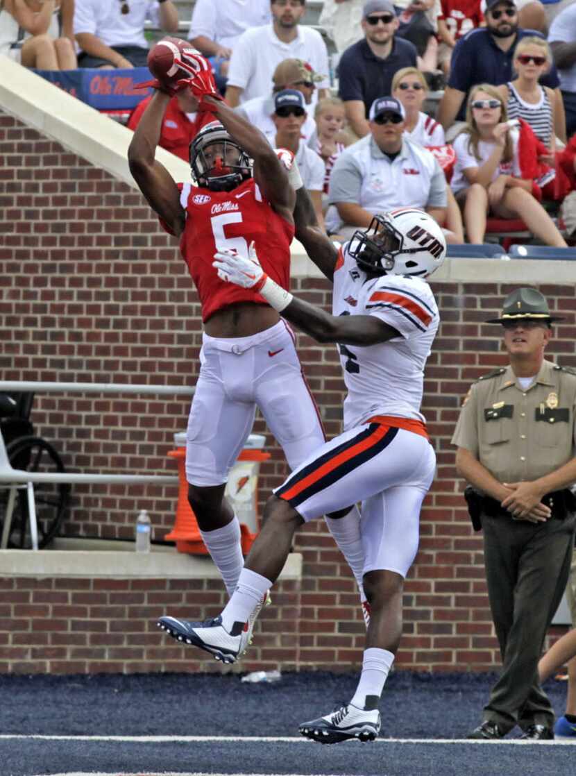 OXFORD MS -SEPTEMBER 5:  Wide receiver DaMarkus Lodge #5 of the Mississippi Rebelscatches a...