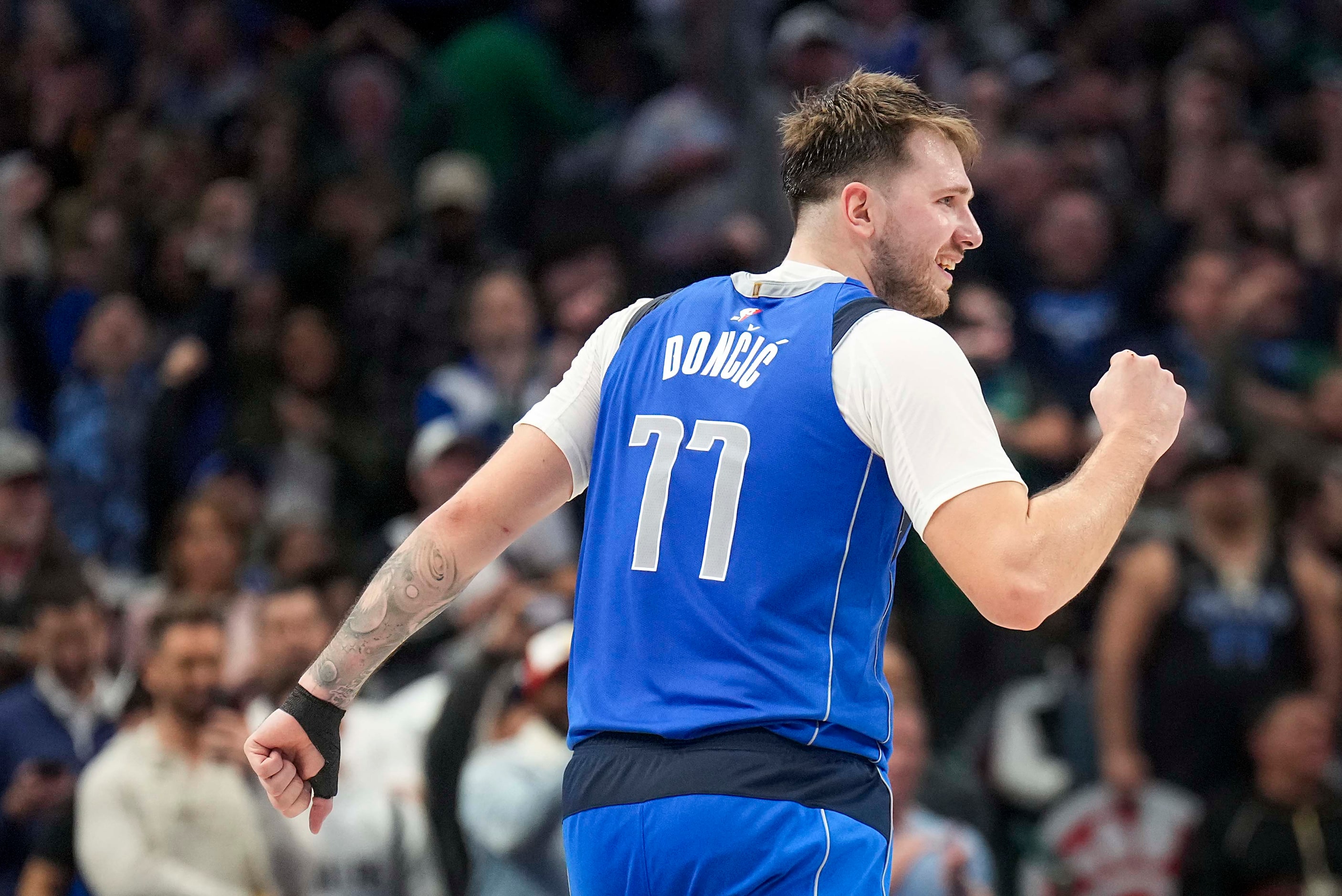 Dallas Mavericks guard Luka Doncic  celebrates after his layup gave the Mavericks the lead...