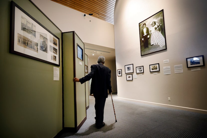 Harry Robinson Jr., founder of Dallas' African American Museum, walks along an exhibit that...