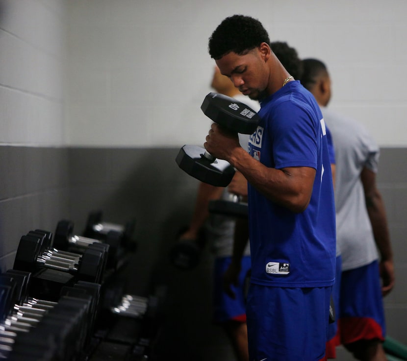 Texas Rangers minor league player Leody Taveras lifts weights during training at Arlington...