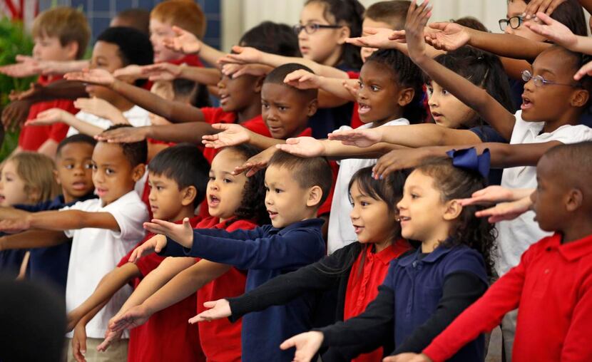 
Students from the Mandarin Chinese magnet program at Weaver Elementary School sing in...