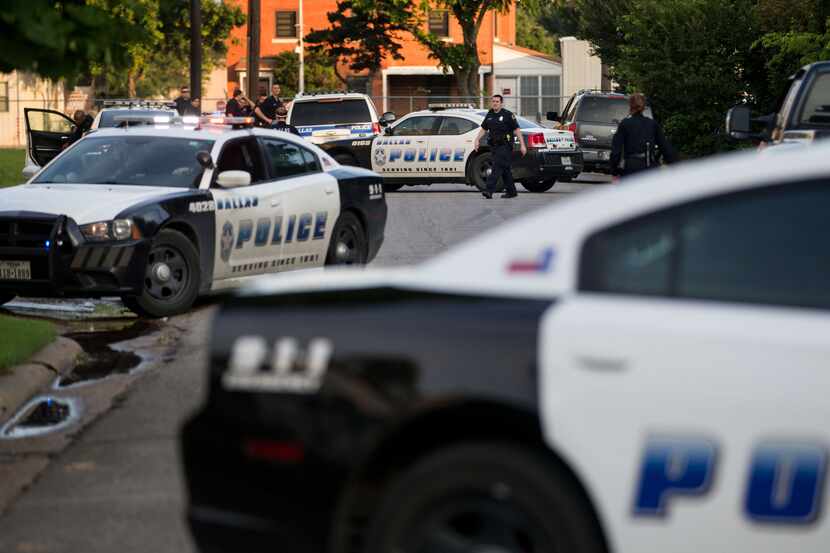 Police officers respond to a shooting near the VA Medical Center in Dallas.