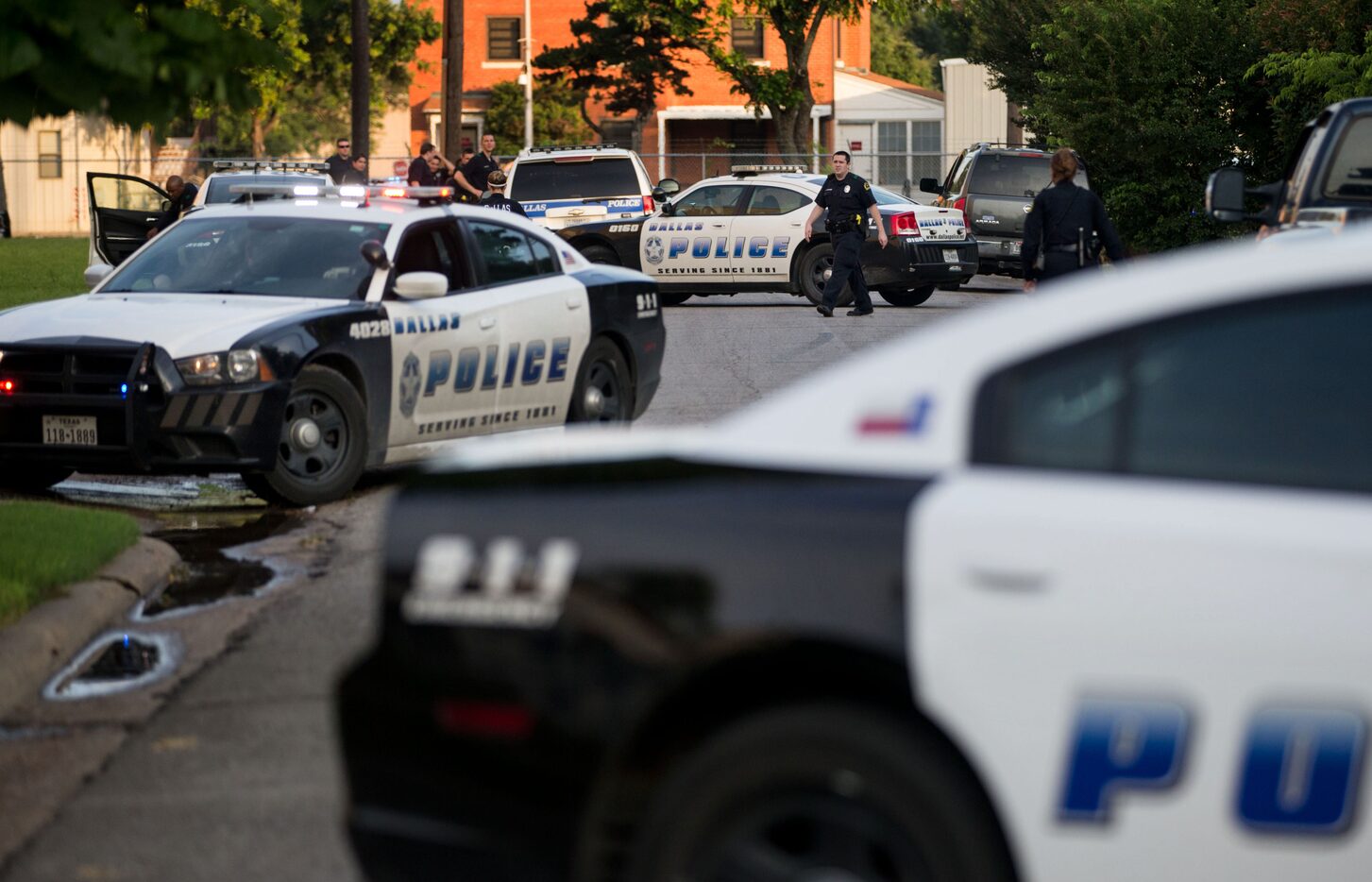 Police officers respond to a shooting near the VA Medical Center in Dallas.