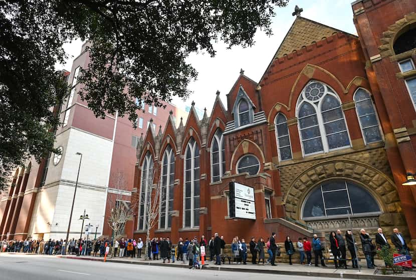 People lined up outside First Baptist Dallas on  Dec. 19, 2021, for Sunday morning church...