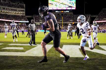 TCU tight end Jared Wiley (19) scores on a 4-yard touchdown pass as Kansas State safety Kobe...