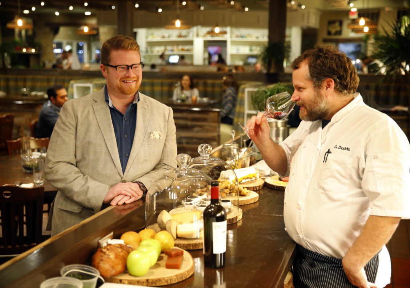 Wayward Sons beverage director Aaron Benson (left) and chef-owner Graham Dodds taste a...
