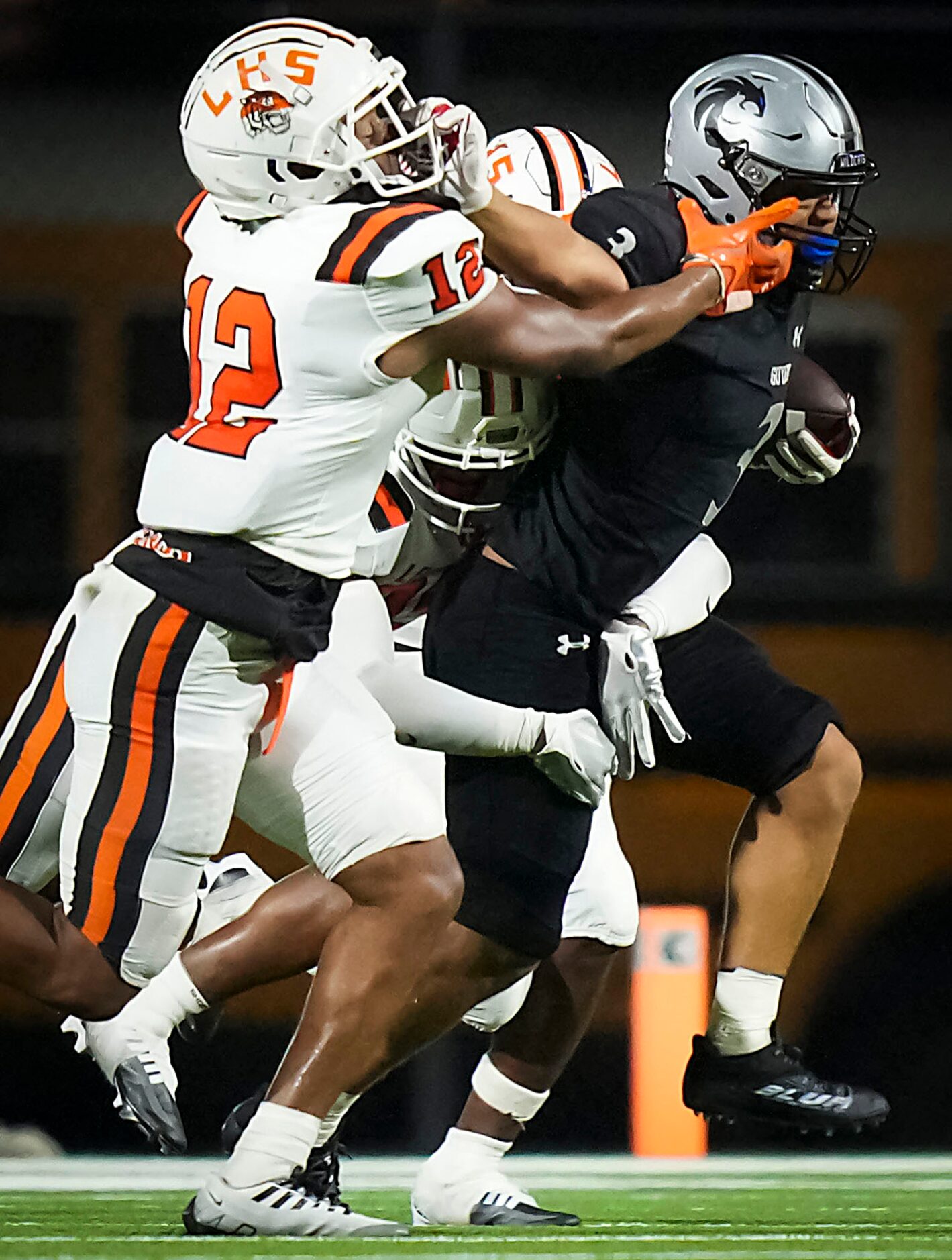 Denton Guyer running back Trey Joyner (3)
 pushes past Lancaster linebacker Ronald Warran...