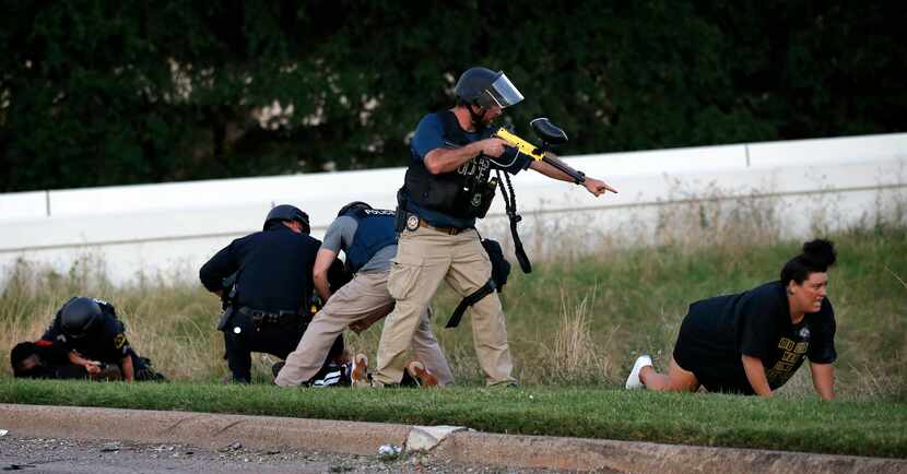  Dallas police arrested peaceful protesters near Interstate 35E on May 30. The officer...