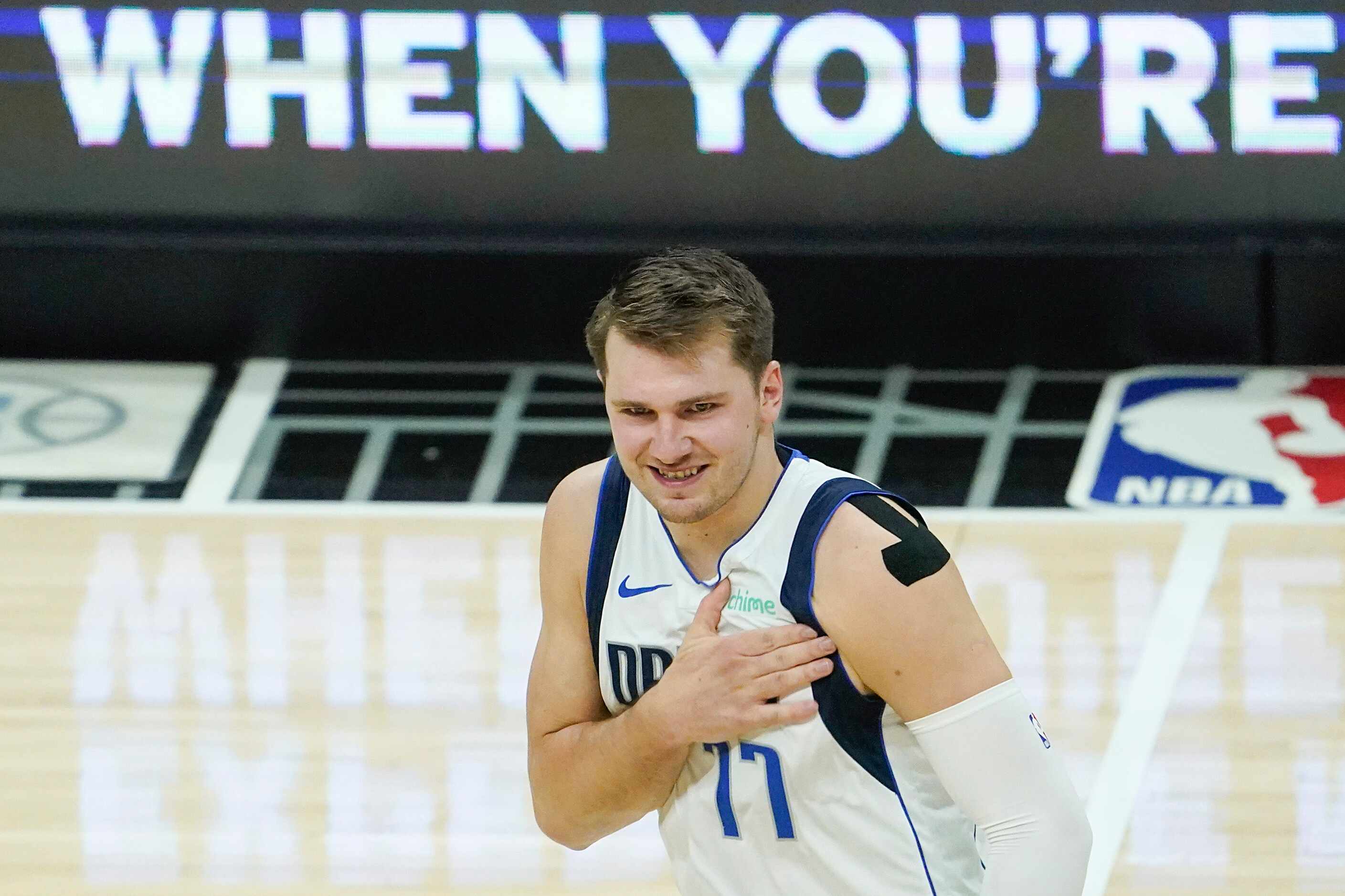 Dallas Mavericks guard Luka Doncic (77) celebrates after making a 3-pointer during the first...