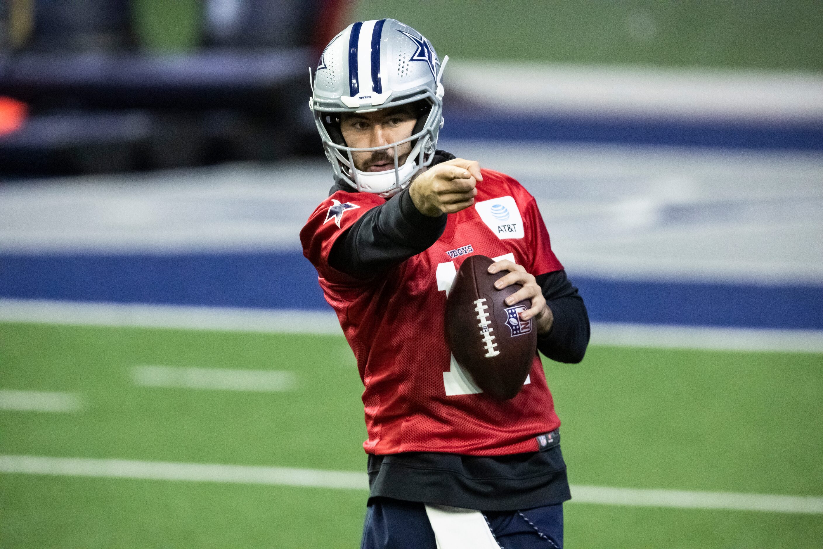 Dallas Cowboys quarterback Ben Dinucci signals to a teammate during practice at The Star in...