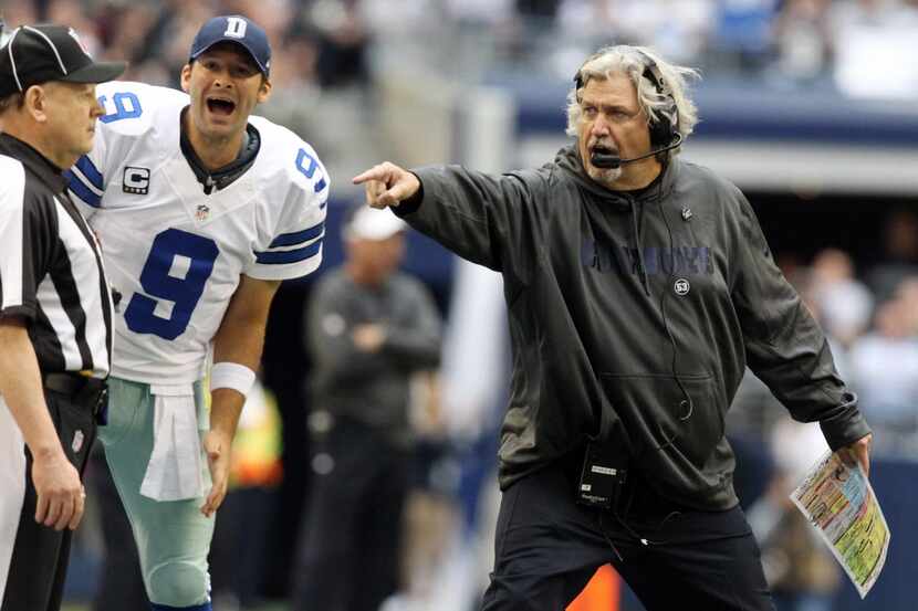 Defensive coordinator Rob Ryan, right, and quarterback Tony Romo yell to get an official's...