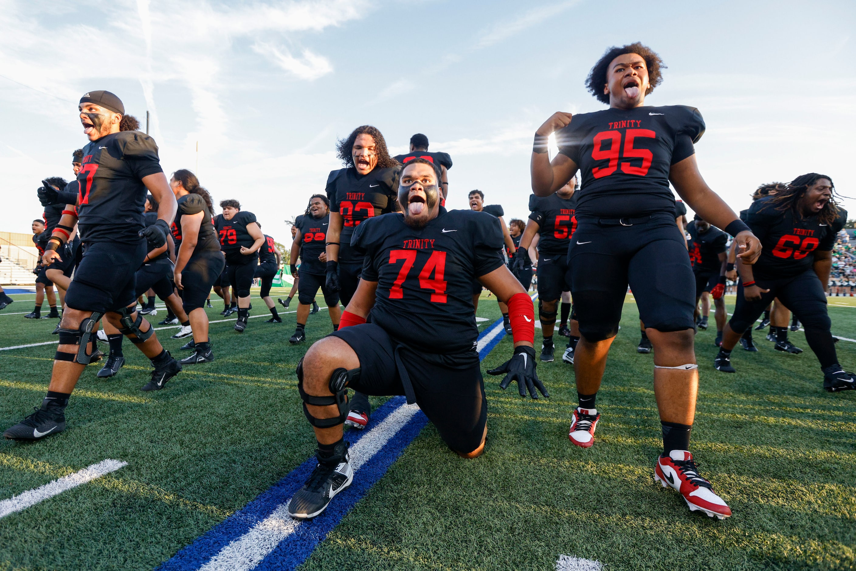 The Euless Trinity football team does the Sipi Tau before the first half of a District 4-6A...