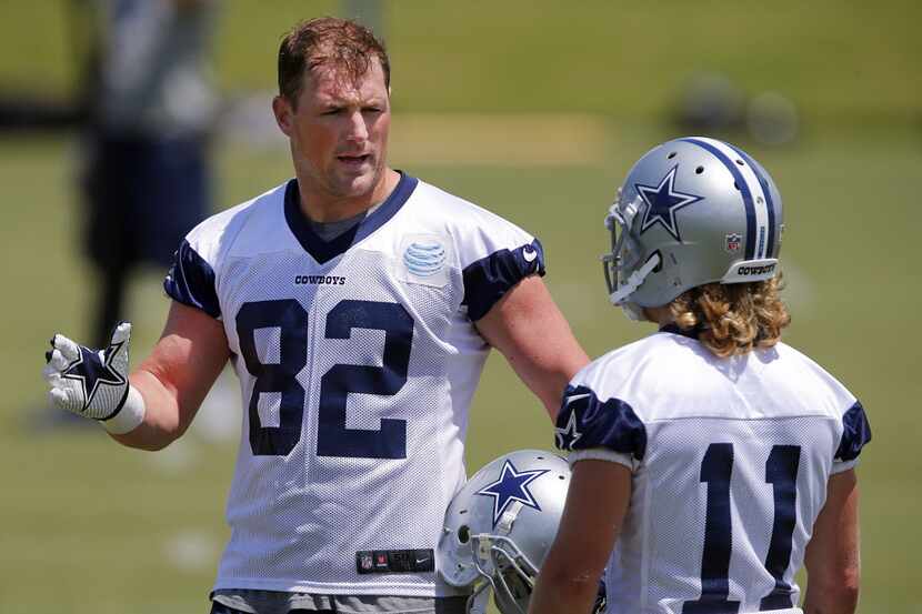 Dallas Cowboys tight end Jason Witten (82) gives some advice to wide receiver Cole Beasley...