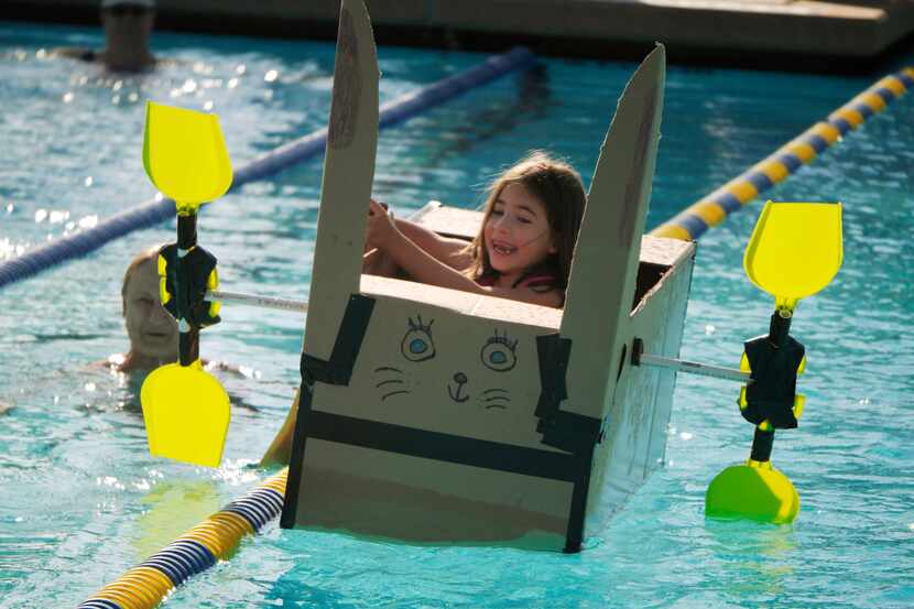 Ava Araujo, 6, gets tangled up in a lane divider at the start of the 2013 Cardboard Regatta.
