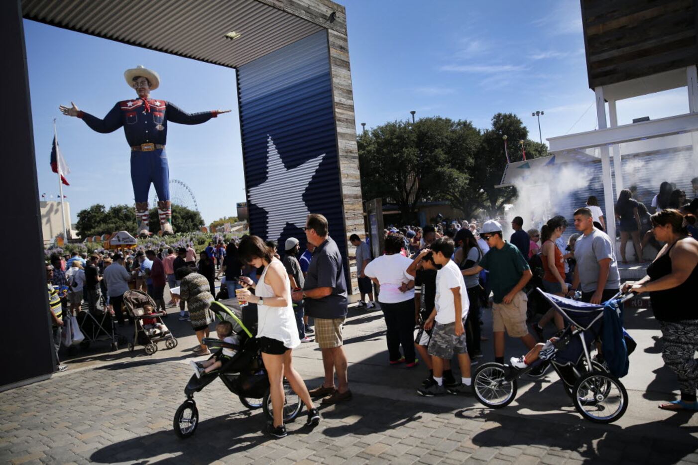 Fair goers converge on Big Tex Circle, Friday, October 16, 2015. Attendance is expected to...