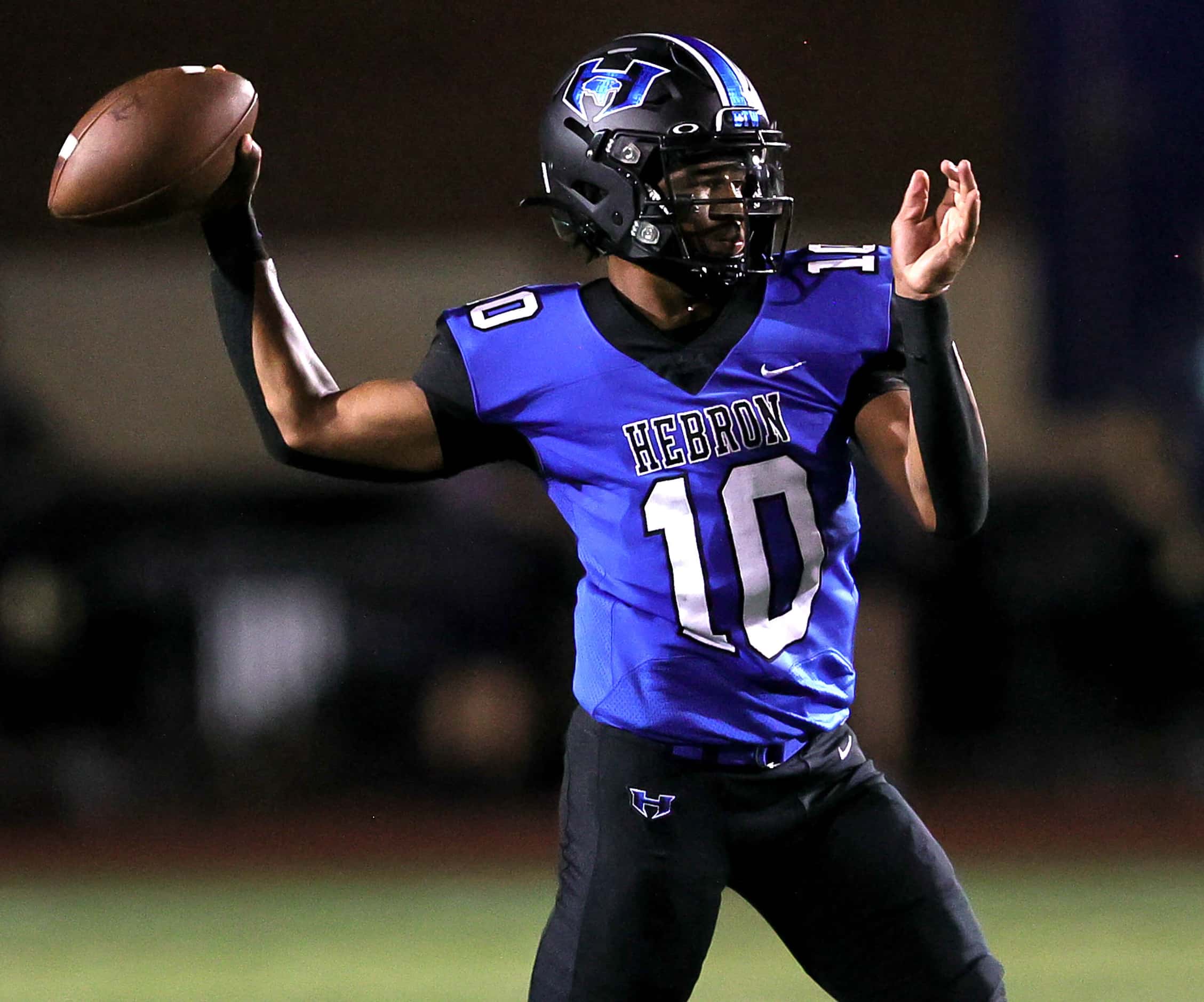 Hebron quarterback Patrick Crayton Jr attempts a pass against Eaton during the first half of...