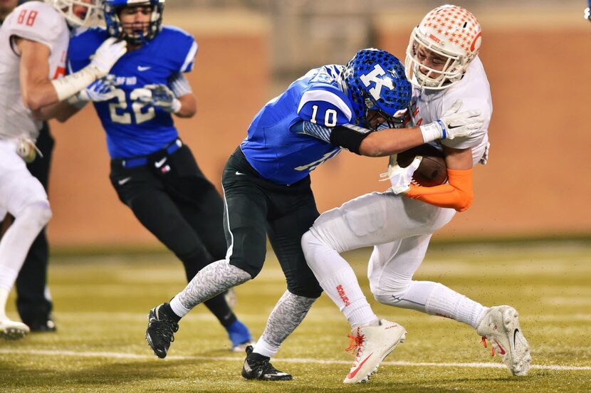 Krum senior linebacker Christian Martinez (10) wraps up Celina senior   Braydon Watson (2),...