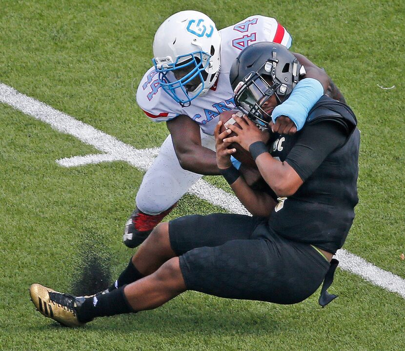 Carter defender Jarell Cherry (44) makes the stop of SOC quarterback Sean Simms (3) in the...