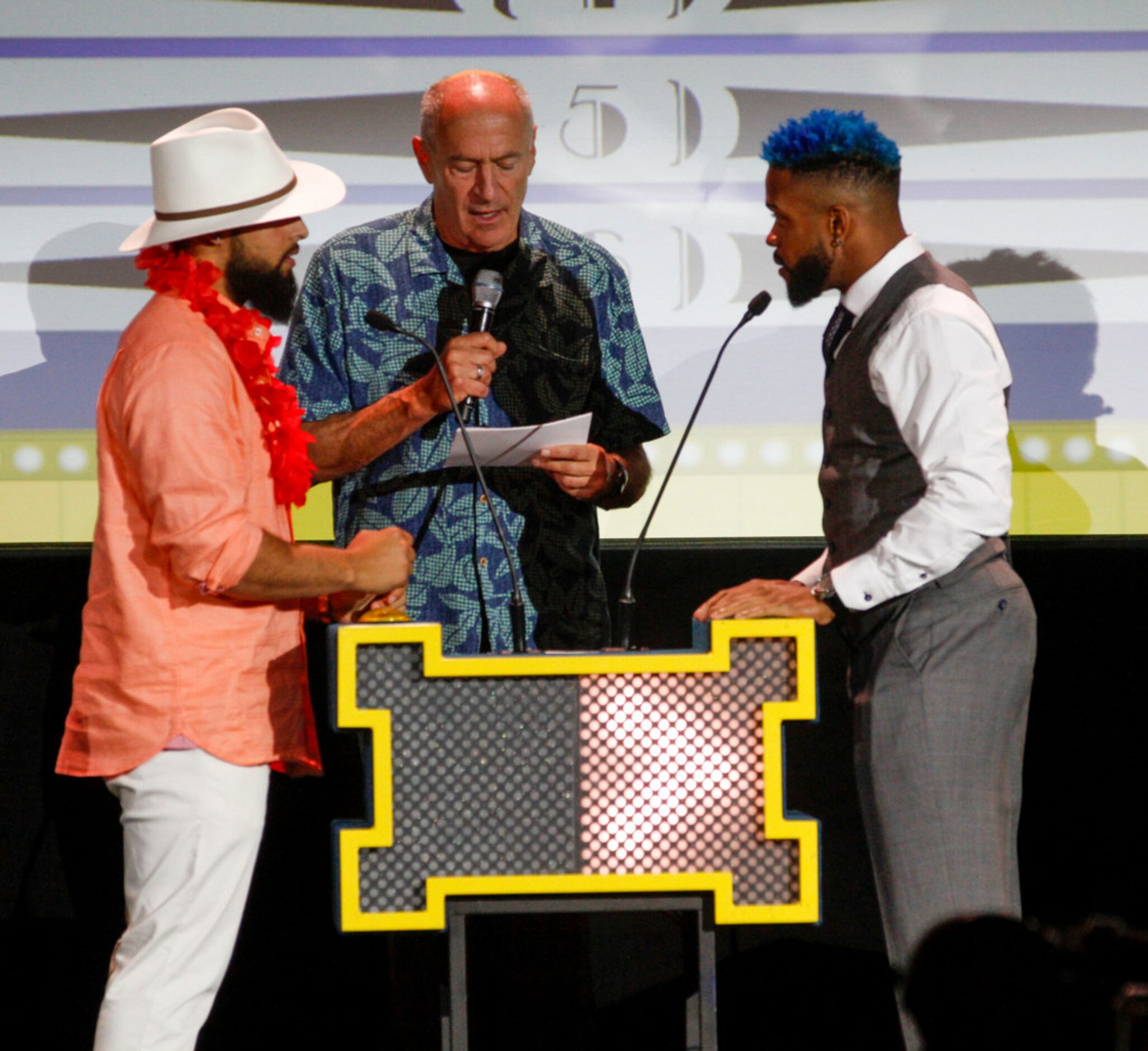 Rougned Odor (left) and Delino DeShields play "Fielders Feud" with Rangers announcer Eric...