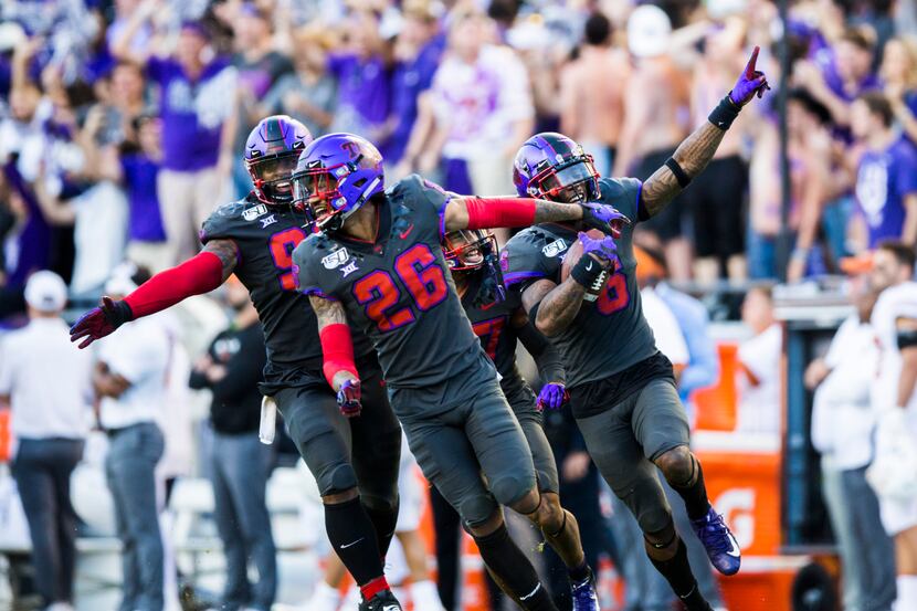 TCU Horned Frogs celebrate after safety Innis Gaines (6) caught an interception that...