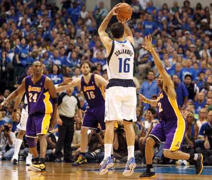 Dallas' Peja Stojakovic launches a three-pointer in the second quarter during Game 4 of the...