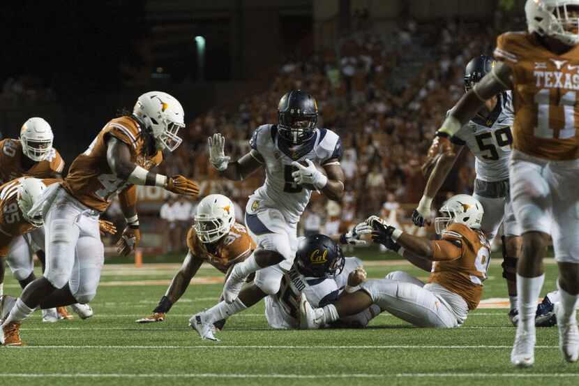 FILE - California's Tre Watson (5) breaks free against Texas during the third quarter of a...