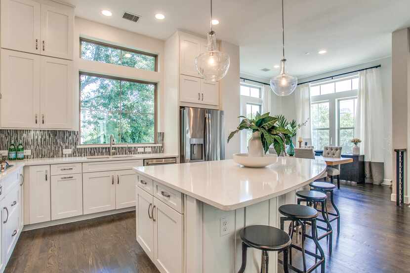The four-story end-unit townhome at 730 Spanish Oaks Place has a well-equipped kitchen.