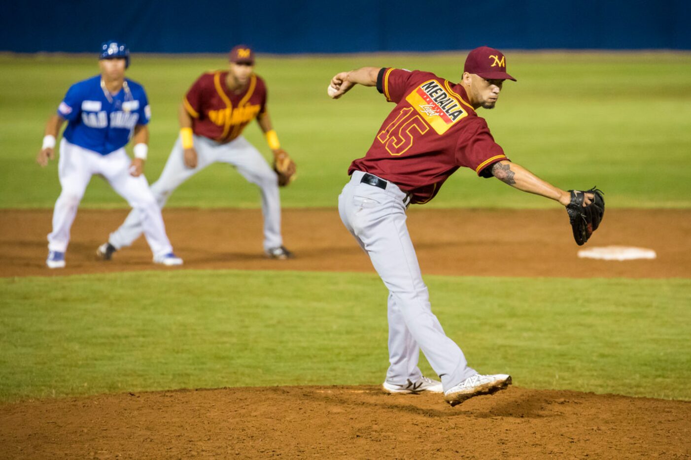 Indios de Mayaguez pitcher Alex Claudio delivers a pitch during the ninth inning of a Puerto...