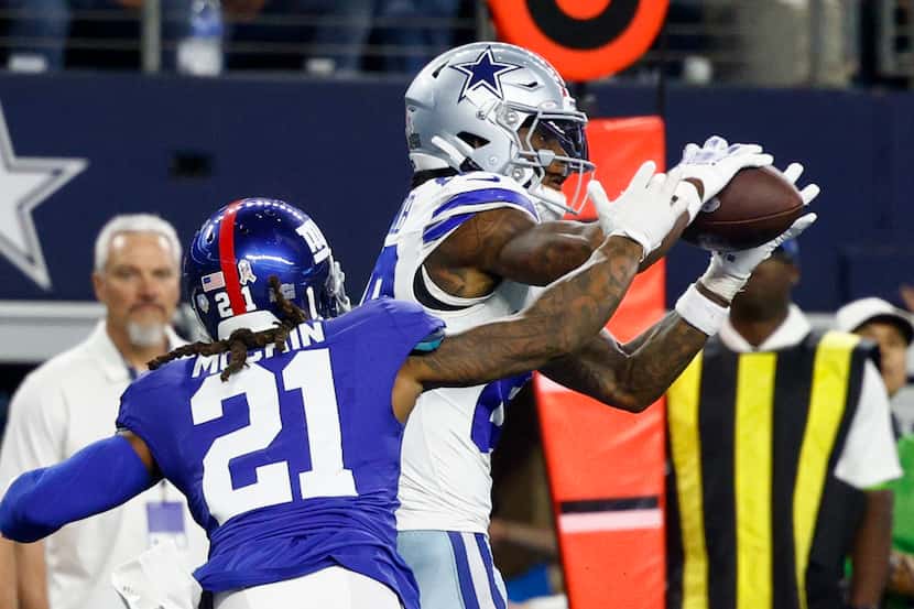 Dallas Cowboys wide receiver CeeDee Lamb (88) catches a pass ahead of New York Giants safety...