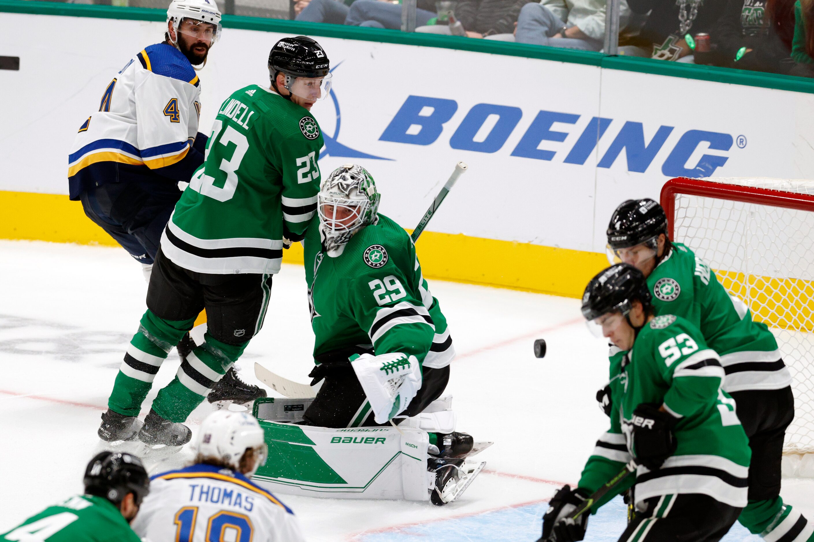 Dallas Stars goaltender Jake Oettinger (29) watches as a shot floats past him towards goal...