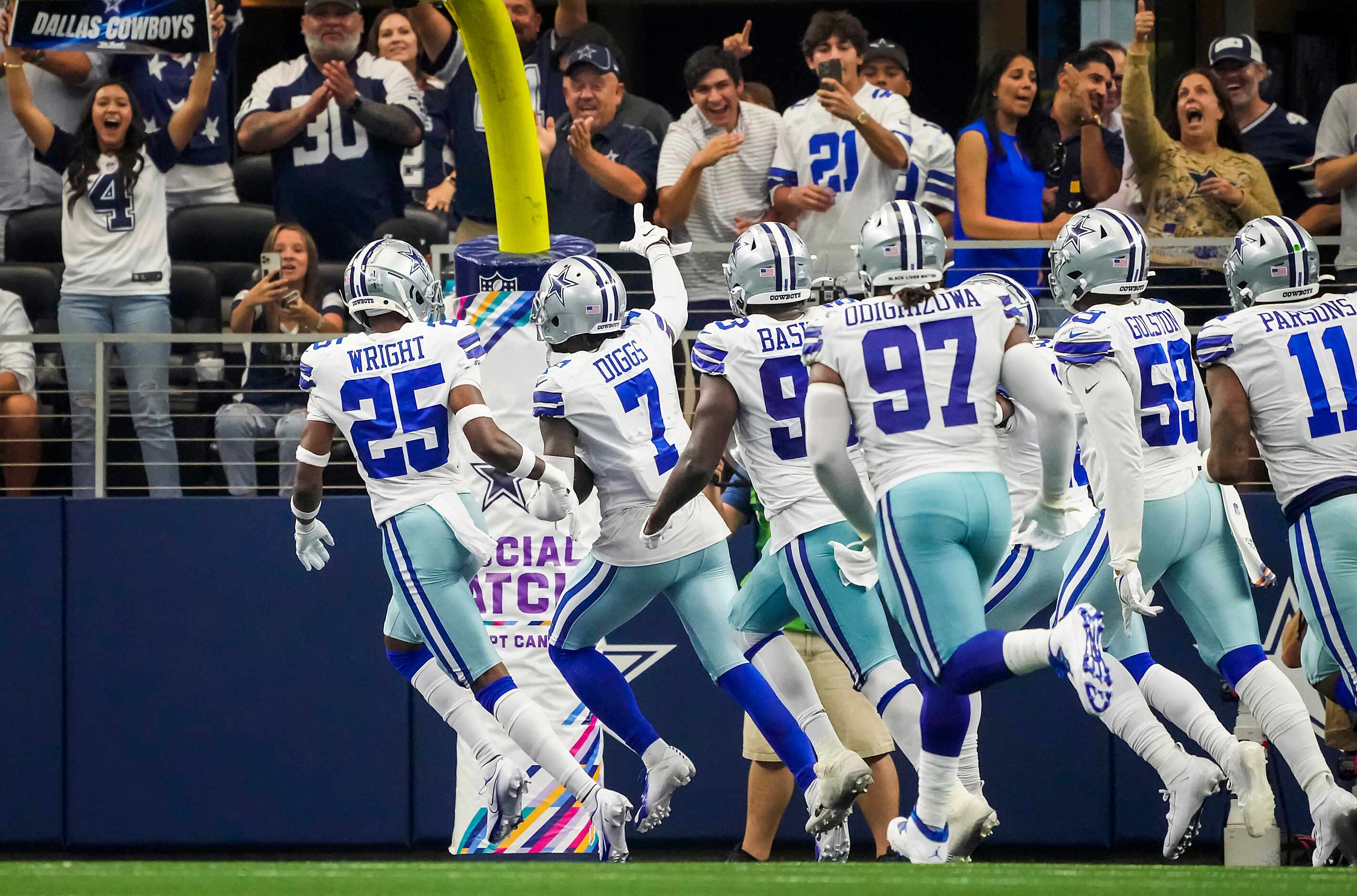 Fans cheer as Dallas Cowboys cornerback Trevon Diggs (7) celebrates with teammates after...