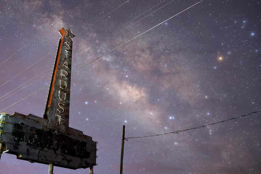 The Milky Way galaxy rises behind the old Stardust Motel sign outside Marfa, Texas, March...