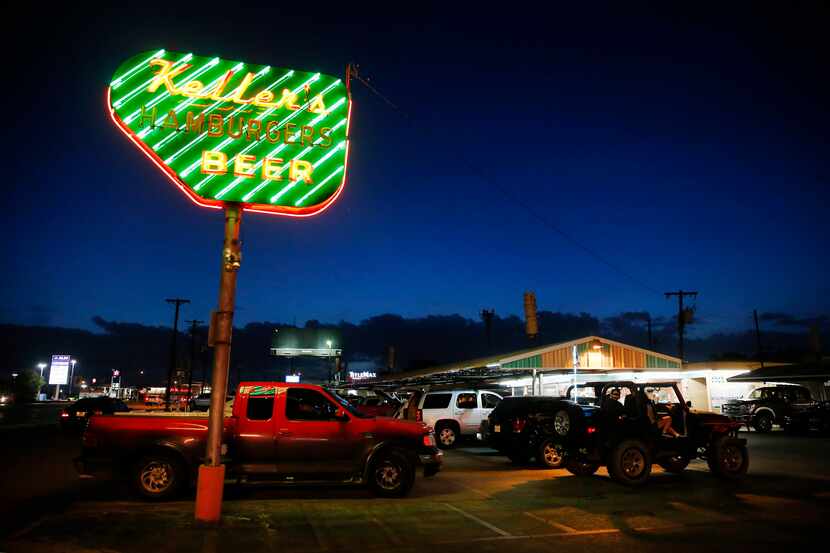 At dusk, the neon sign at Keller's Drive-In glows on Northwest Highway in Dallas, Thursday,...
