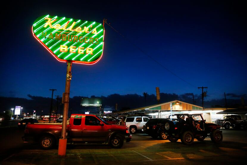 At dusk, the neon sign at Keller's Drive-In glows on Northwest Highway in Dallas.